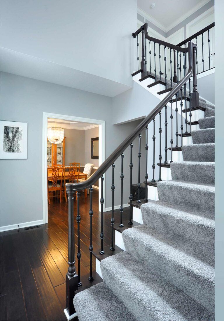 Custom staircase with wood balusters and trim