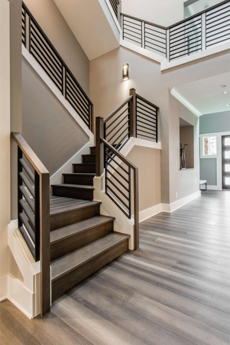Linear-style staircase railing and baluster detail